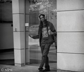 streetie Queen Street Auckland city, black and white photo by Mike Wheelton